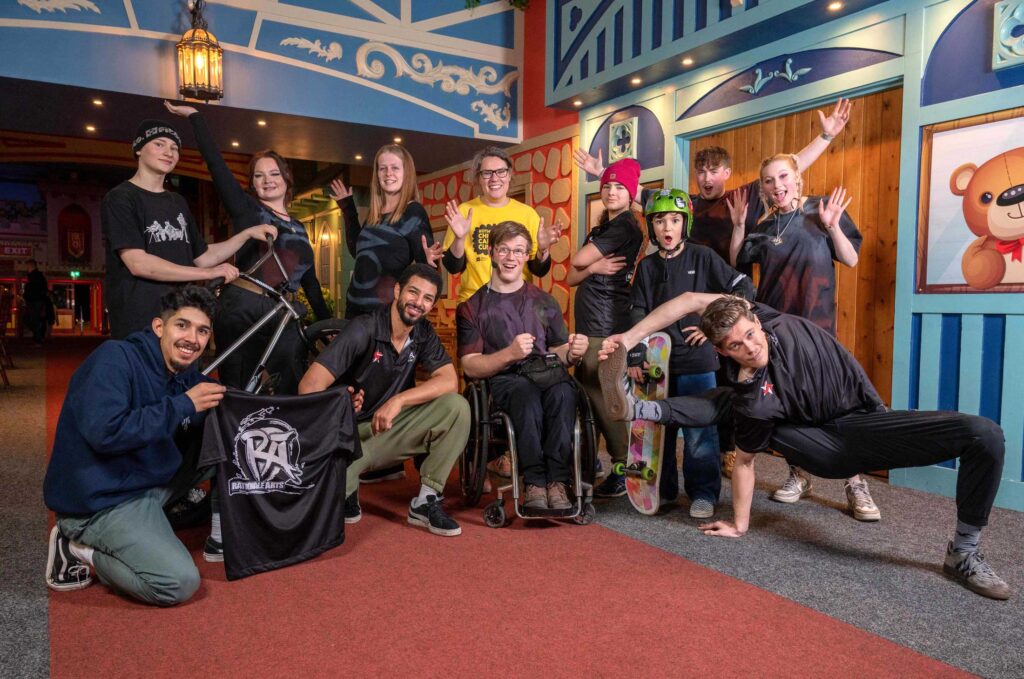 Diverse group of young people pose together