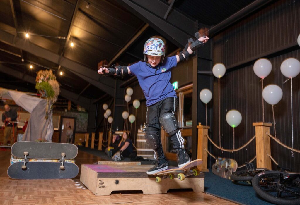 Young skateboarder with a helmet on